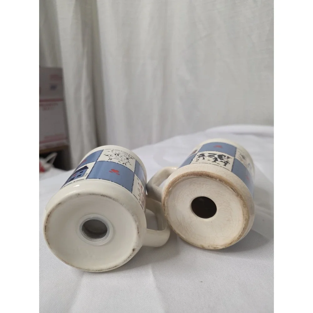 Checkerboard Farms ceramic salt and pepper shakers featuring a blue and white...